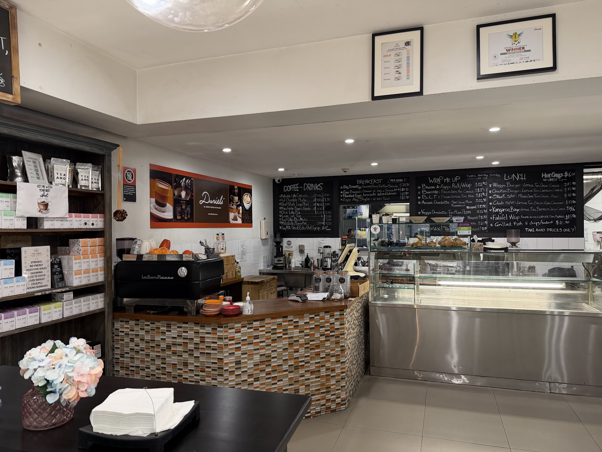 Cafe Danieli counter with espresso machine and menu boards